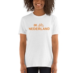 May include: White t-shirt with the text "IK NEDERLAND" and a bicycle icon in orange.