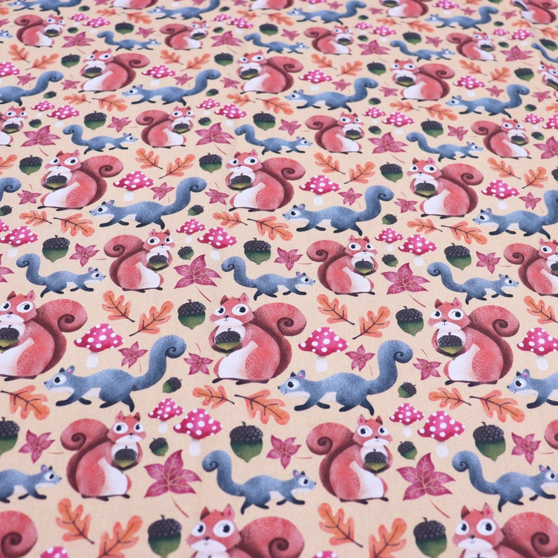 May include: A beige fabric with a repeating pattern of red squirrels holding acorns, blue squirrels, and brown leaves. The background is a light beige color.