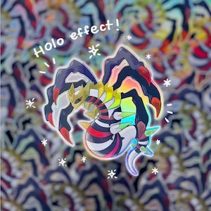 Pode incluir: Um adesivo holográfico com uma ilustração de desenho animado colorida de um Pokémon com o texto "Holo effect!" acima.