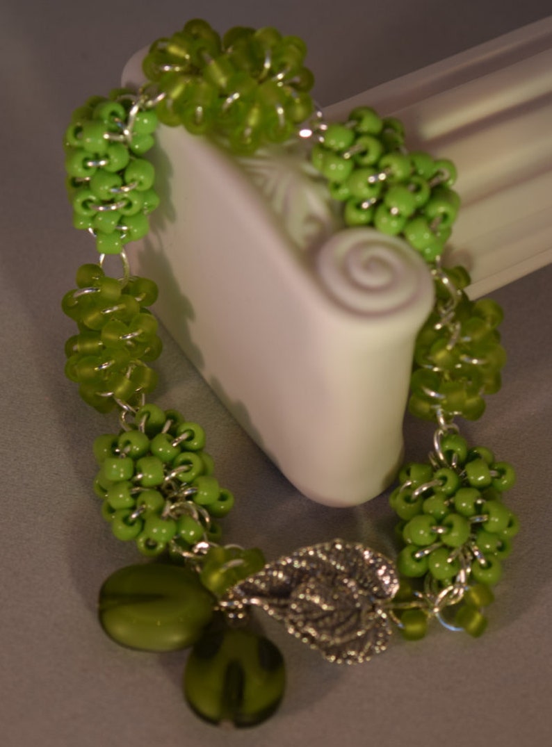 Green Handmade Beaded Bracelet Silver Tone Findings with Sterling Silver Pointed Leaf Interlocking Clasp