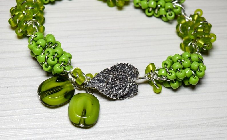 Green Handmade Beaded Bracelet Silver Tone Findings with Sterling Silver Pointed Leaf Interlocking Clasp