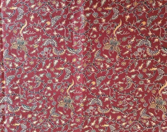 Traditional Indonesian batik fabric, madura sarong, pareo, java batik in dark maroon