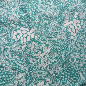 Indonesian batik hand drawn on cotton-lyocell blend fabric. Soft turquoise floral batik design sarong/ kebaya skirt.