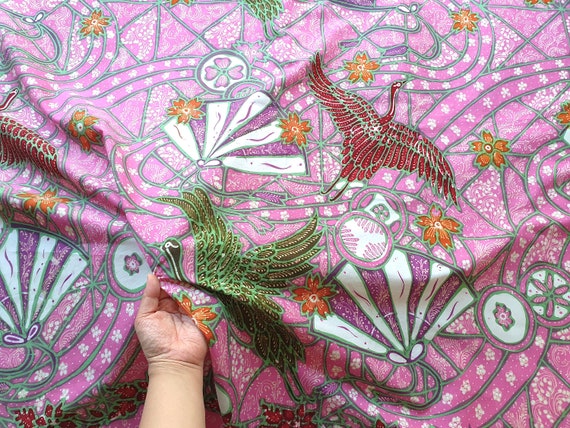 Pink Indonesian batik fabric, Japanese inspired design of cranes and hand fans in stained glass style