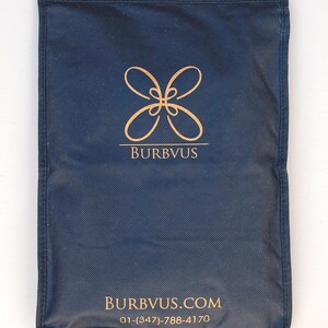 May include: A dark blue fabric bag with a gold logo that says "BURBVUS" and the website address "BURBVUS.COM" and phone number "01-(347)-788-4170".