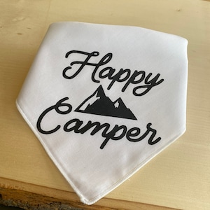 May include: White bandana with black text that reads "Happy Camper" and a black silhouette of mountains.