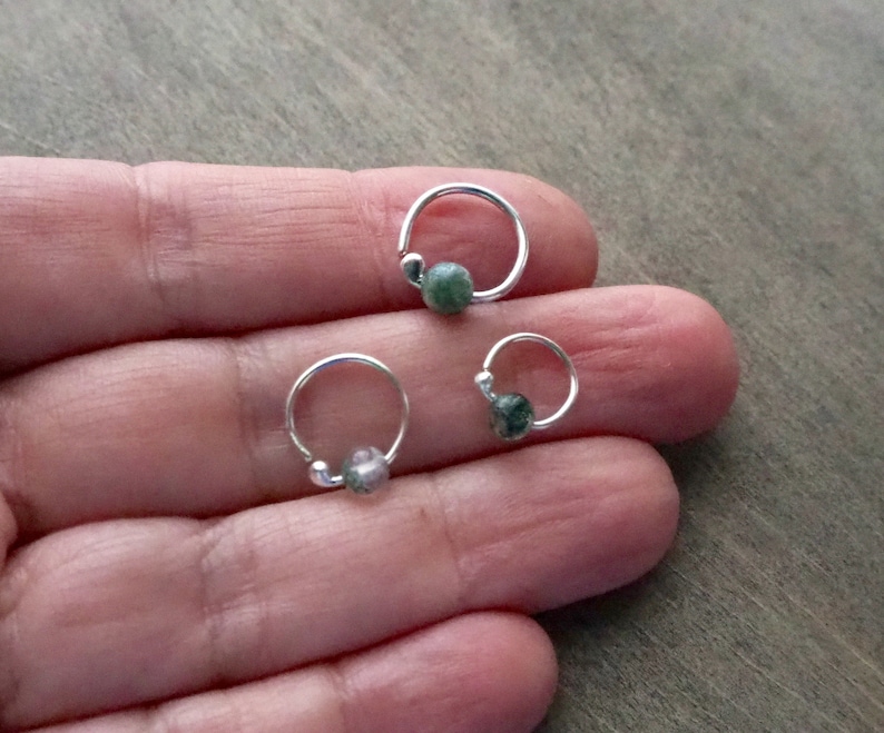 Three sterling silver hoops with bead of moss agate on a hand to show dimensions. Please, choose gauge and dimensions at checkout.