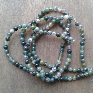 Moss agate beads. Please, feel free to contact me if you have a specific texture or color in mind.