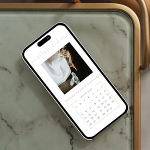 May include: A white ceramic mug with a black handle and the text "But First, Coffee" in a black, handwritten-style font. The mug is on a white surface.