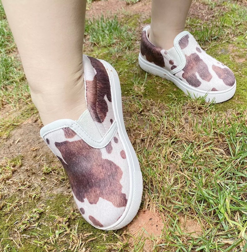 cow print slip on sneakers
