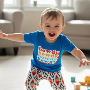 Retro Howdy Kids Western Outfit! 🤠✨ Featuring stylish Aztec jogger pants and a retro-inspired "Howdy" tee, this fun and comfy set is perfect for playtime, casual outings, or celebrating Western-themed events. 💥👕 Ships FREE with $35+ order
