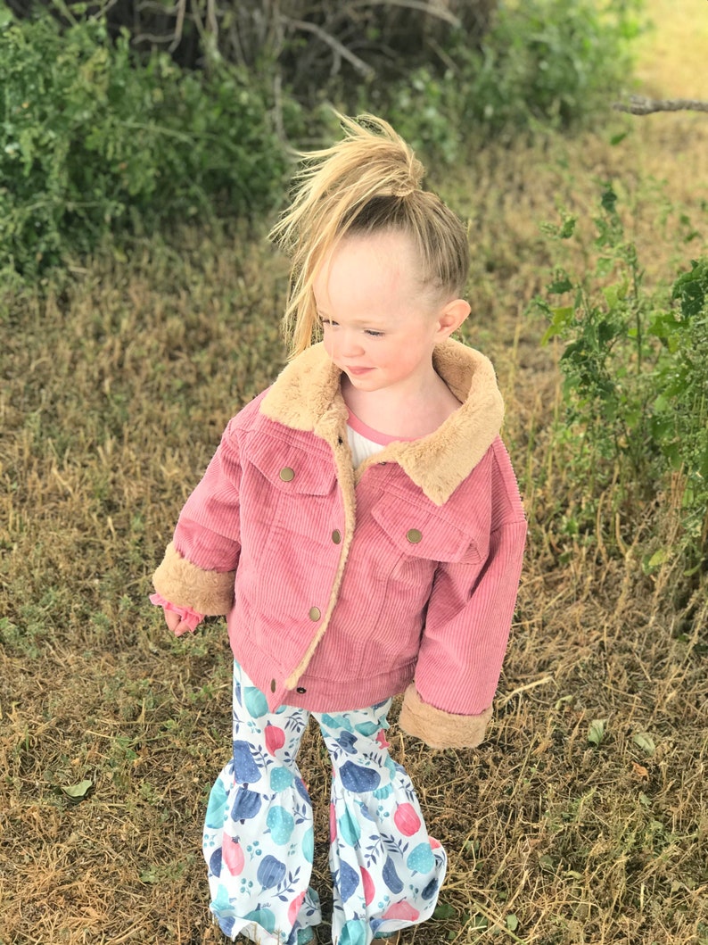 Jernie modeling the pink Corduroy Coat with Sherpa lining.