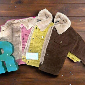 Kids Western Corduroy Coats with very soft and warm Sherpa lining. Available in pink, yellow and brown.