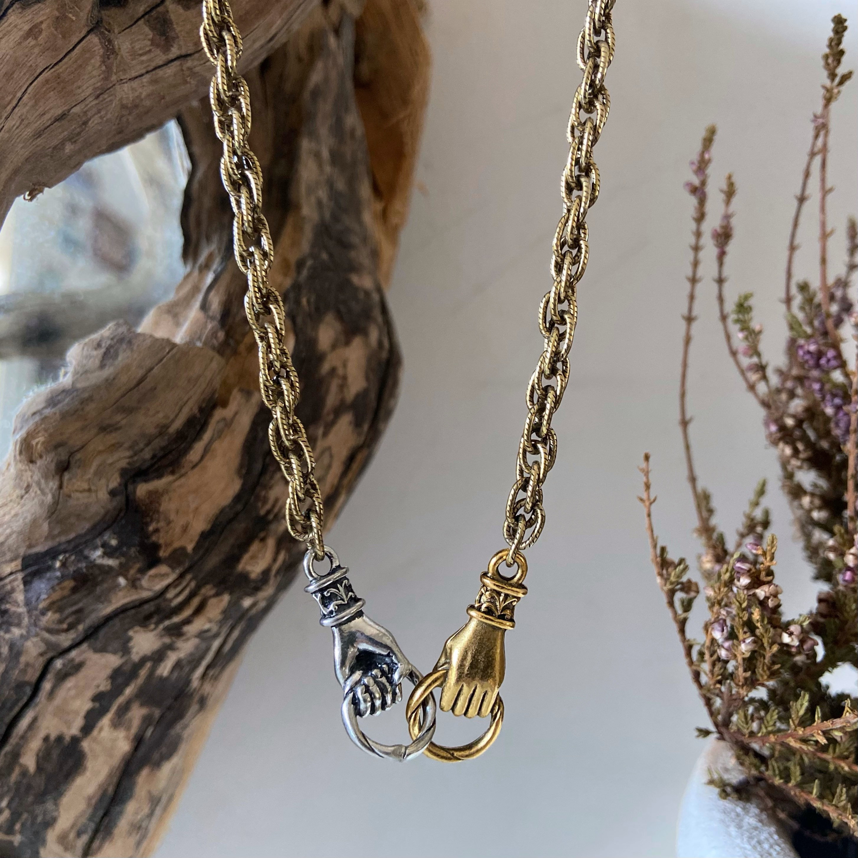Hand clasp necklace sale