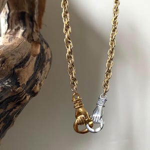 Mixed Metal Interlocking Hands Necklace
