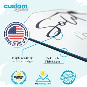 May include: A white sign with black text that reads "Sold" and "The Love Story Begins". The sign is made in the USA and is 1/4 inch thick. It is also UV protected and 100% sustainable.