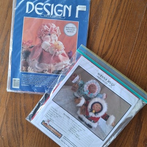 May include: Two craft patterns for making soft sculptures. The first pattern is for a girl doll named Priscilla, and the second pattern is for a pair of dolls named Wanna Hug? The patterns are printed on white paper with black text and illustrations.