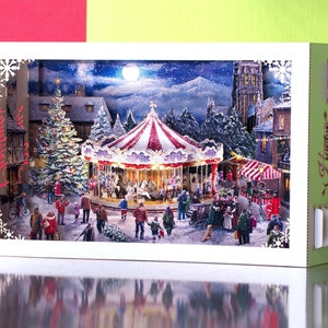 Christmas Carousel paper pop up card. 3d box greeting. New Year gift card. Laser cut kirigami model of city holiday party. Folded cards Xmas