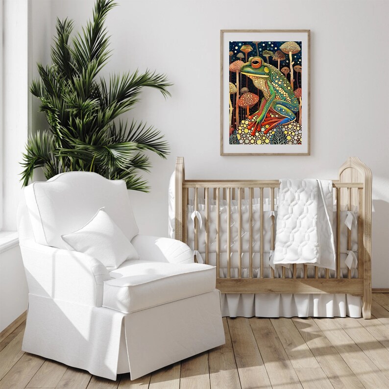 May include: A white nursery glider with a white pillow and a wooden crib with a white quilt. A framed print of a green frog sitting on a mushroom in a forest setting hangs on the wall.