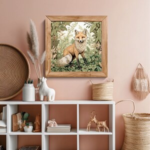 May include: A framed illustration of a red fox standing in a lush green forest. The fox is looking directly at the viewer with a curious expression. The frame is made of wood and has a light brown finish.