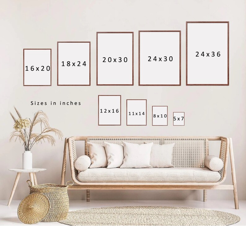 May include: A variety of picture frames in different sizes, ranging from 5x7 inches to 24x36 inches. The frames are all brown and have a simple, modern design. The frames are displayed on a white wall with a couch and a wicker basket in the foreground.