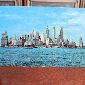 Cartão-postal não utilizado com a imagem dos arranha-céus de Manhattan, Nova Iorque, Manhattan Post Card Pub Co.