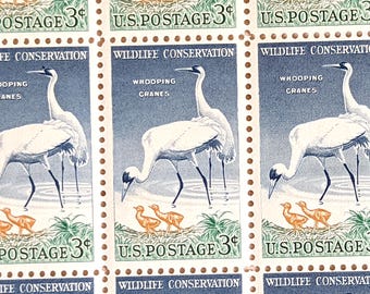 May include: Three vintage US postage stamps featuring a whooping crane in a blue and white design. The stamps are 3 cents each and say "Wildlife Conservation" and "Whooping Cranes".