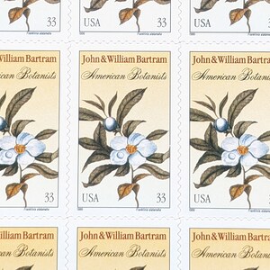 May include: A sheet of postage stamps featuring a botanical illustration. Each stamp displays a white flower with a yellow center, blue berries, and brown leaves. The text "John & William Bartram American Botanists" and "USA 33" are printed on each stamp.