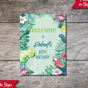 May include: A tropical-themed welcome sign with green leaves, pink flowers, and parrots. The sign says "Welcome to Robert's 60th Birthday".