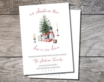 May include: A Christmas-themed card with a watercolor illustration of a Christmas tree, snowman, gifts, and candles. The text reads "our christmas tree has a new home" and includes address details. A red banner says "Printed or Digital".