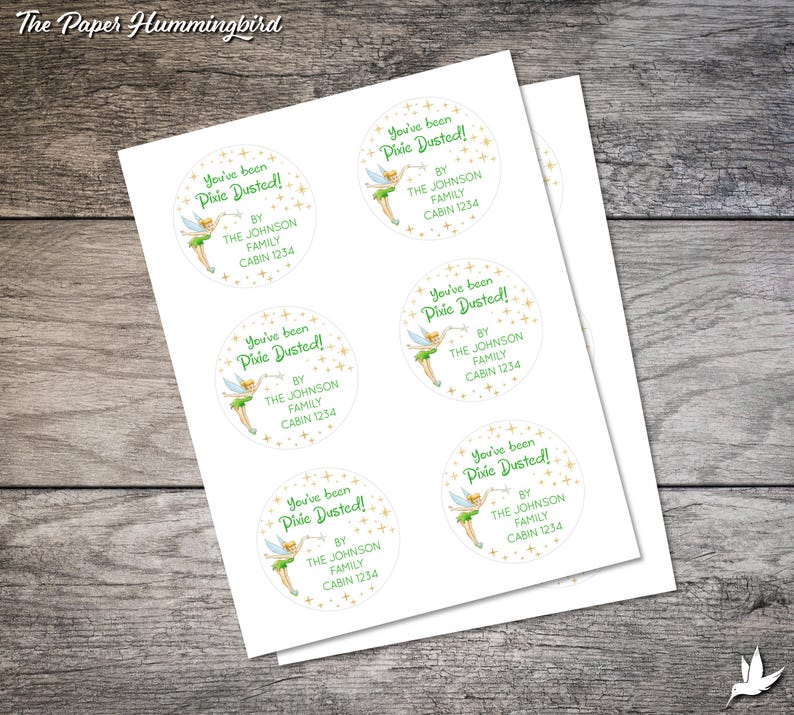 May include: Six round stickers featuring a green fairy character holding a wand against a gold star background. The text on the stickers reads "You've been Pixie Dusted!" with the words "By The Johnson Family Cabin 1234" underneath.