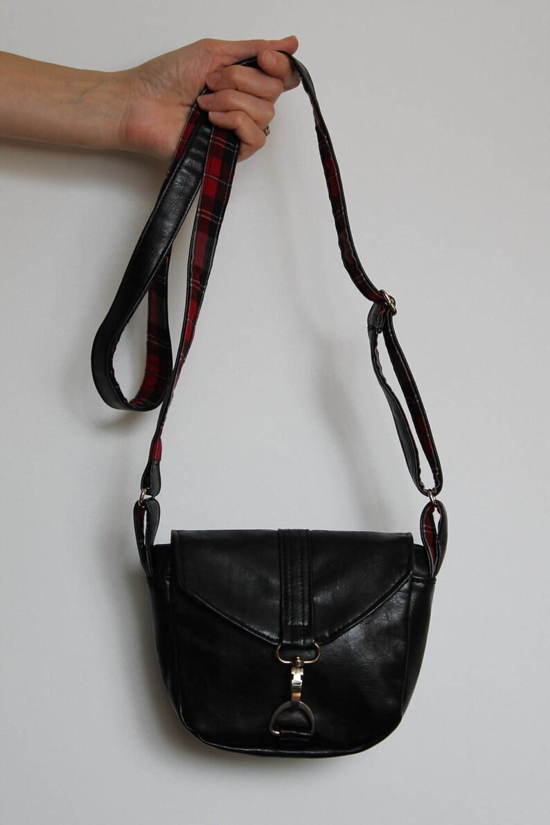 small black handbag with long strap