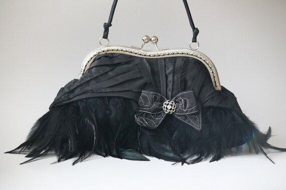 black feather clutch