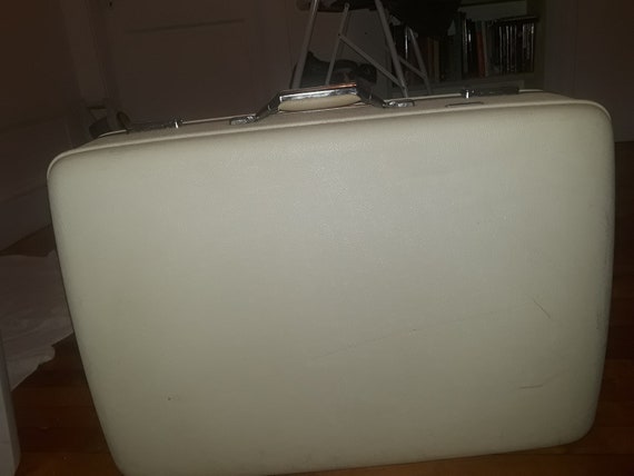 white vintage luggage