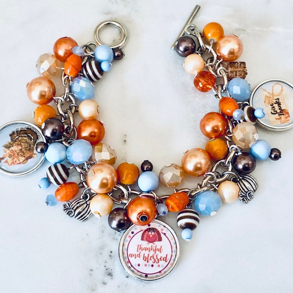 Thanksgving Charm Bracelet with various Orange, Brown, Copper and light blue colored beads