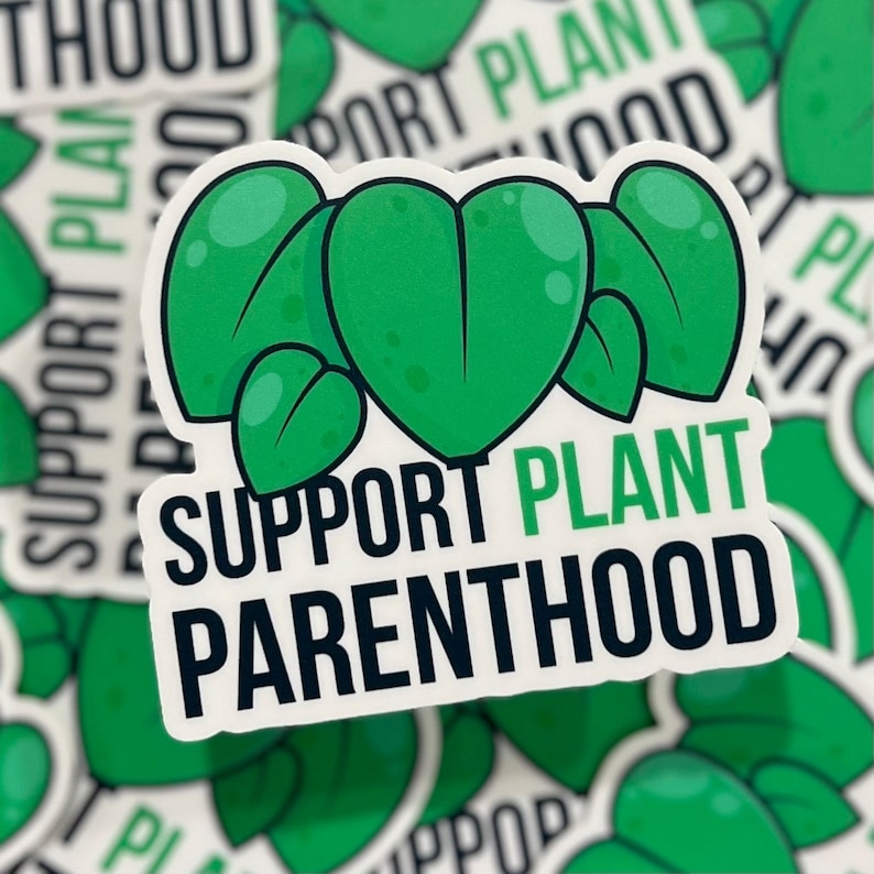 May include: A white sticker with green plant illustrations and the text "SUPPORT PLANT PARENTHOOD".