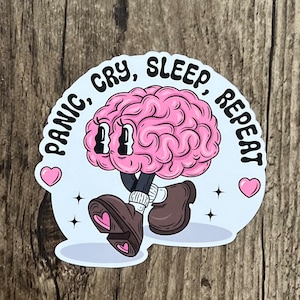May include: A pink brain with eyes and legs walking with the text "Panic, Cry, Sleep, Repeat" around it.