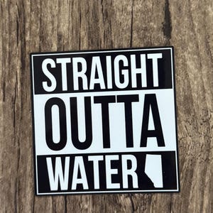 May include: A square sticker with a black and white design featuring the text STRAIGHT OUTTA WATER in bold, sans-serif capital letters. The word STRAIGHT is in white on a black background, OUTTA is in black on white, and WATER is in white on black.