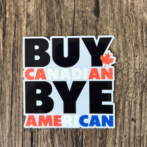 May include: A rectangular sticker featuring the bold black text BUY and BYE, with the red text CANADIAN and the red and blue text AMERICAN. A small red maple leaf icon is positioned next to the word BUY on a white background with a thin border.