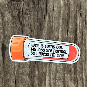 May include: A sticker in the shape of a test tube with the text "Well, it turns out my labs are normal, so I guess I'm fine." The sticker has orange and red accents.