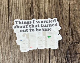 May include: White sticker with the text "Things I worried about that turned out to be fine" and a graphic of three stacks of paper.