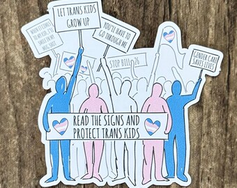 May include: A sticker with a cartoon illustration of a group of people holding signs that read "Let Trans Kids Grow Up", "You'll Have to Go Through Me", "Stop Bill 26", "Gender Care Saves Lives", and "Read the Signs and Protect Trans Kids".