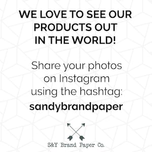 May include: A white and gray geometric pattern background with black text that reads "WE LOVE TO SEE OUR PRODUCTS OUT IN THE WORLD! Share your photos on Instagram using the hashtag: sandybrandpaper" and a black and gray arrow graphic with the text "S&Y Brand Paper Co."