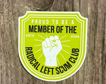 May include: A sticker with a lime green shield design and white border. The text reads "PROUD TO BE A MEMBER OF THE RADICAL LEFT SCUM CLUB" with a white fist graphic. The year "2025" is also included.