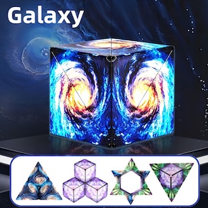 May include: A cube-shaped puzzle toy with a galaxy design, featuring swirling blues, oranges, and whites. The word "Galaxy" is printed at the top. Additional geometric shapes are displayed below, showcasing the toy's versatility.