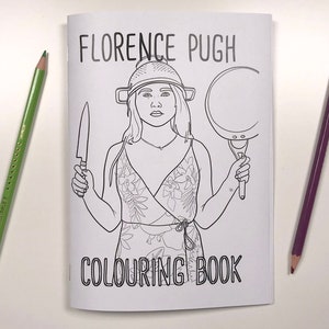 May include: A black and white colouring book cover featuring a line drawing of Florence Pugh wearing a colander on her head, holding a knife in one hand and a frying pan in the other. The text "Florence Pugh Colouring Book" is printed below the image.