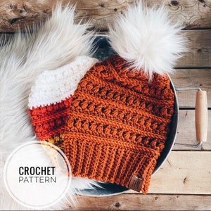 May include: A crochet hat pattern with a white pom pom. The hat is made in a variety of colors, including orange, yellow, and red. The pattern is available for purchase on Etsy.