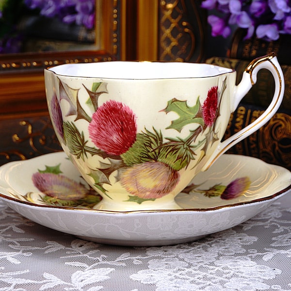 Queen Anne Pale Yellow Teacup and Saucer with Red and Purple Thistles, Scalloped Edges Trimmed in Gold Gilt, English Bone China, 1950s