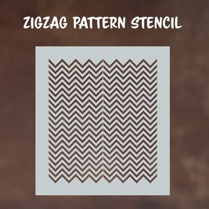 May include: A white stencil with a repeating zigzag pattern. The stencil is designed for use with paint or other mediums to create a decorative chevron pattern.