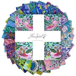 May include: A collection of colorful fabric squares arranged in a circular pattern. The fabrics feature floral and bird designs in shades of blue, pink, green, and purple. The text "Free Spirit" is displayed on a white rectangular label in the center.